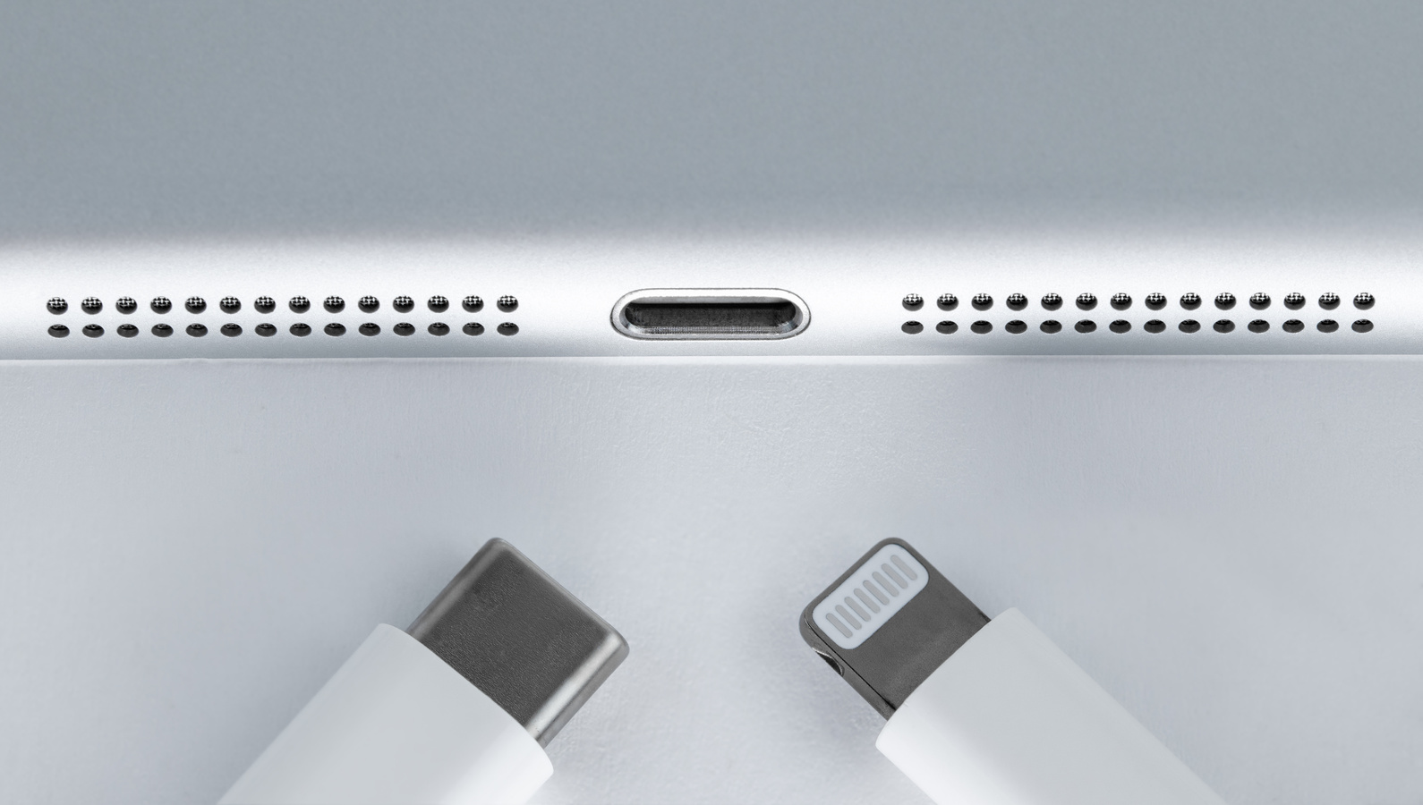 Apple with Lighting and Usb-c Cable Charger on. EU try to Forced phone to Use Usb-c Instead of Lighting Cable.